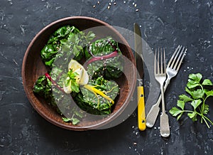 Vegetarian swiss chard packets. Chard leaves stuffed with turmeric lentils and vegetables. Vegetarian healthy food