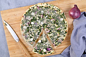 Vegetarian `Tarte Flambee` or `Flammkuchen`, a thin pizza-like baked pie from German-French Alsace border region