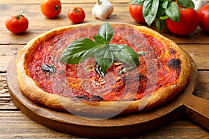 vegetarian tomato pizza marinara on chopping board