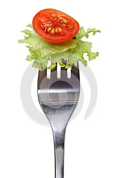 Vegetarian or vegan eating salad on fork isolated
