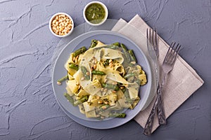 Vegetarian pappardelle pasta with green bean, pesto, pine nuts