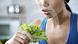 Vegetarian woman holding lettuce salad in hand, healthy eating recommendations