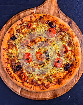Vegetarian wood fired pizza on wooden board