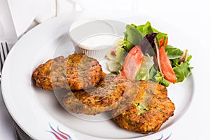 Vegetarian Zucchini Hash Browns Garnished with Vegetables