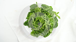 Vegetarianism. healthy eating. Lettuce leaves in a bowl isolated on white background. Mix fresh arugula leaves, lettuce