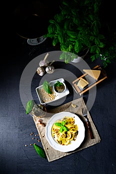 A Vegetariano italiano! Tortelli with roasted pine nuts and pesto basilico photo