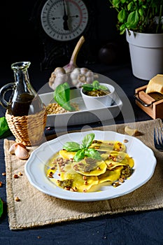 A Vegetariano italiano! Tortelli with roasted pine nuts and pesto basilico photo