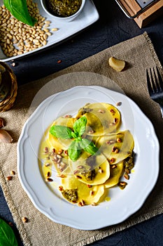 A Vegetariano italiano! Tortelli with roasted pine nuts and pesto basilico photo