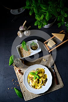 A Vegetariano italiano! Tortelli with roasted pine nuts and pesto basilico photo