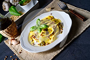 A Vegetariano italiano! Tortelli with roasted pine nuts and pesto basilico photo