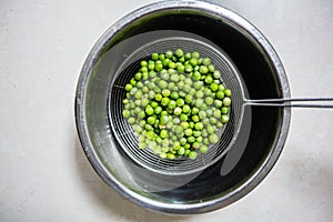 Vegetarians like to eat peas in a birdbath photo