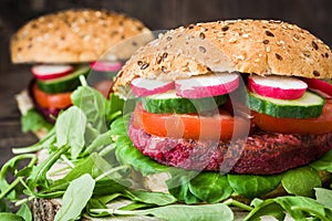 Veggie beet burger on a rustic wood