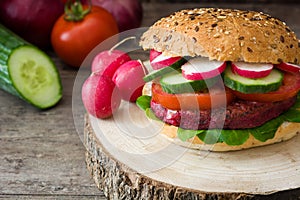 Veggie beet burger on a rustic wood