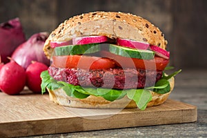 Veggie beet burger on a rustic wooden table