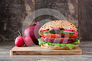 Veggie beet burger on a rustic wooden table