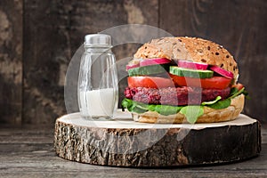 Veggie beet burger on a rustic wooden table