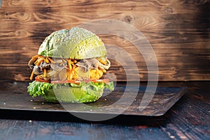 Veggie burger. lettuce. The cutlet consists of chickpeas corn potatoes, fried onions and carrots. mushroom. rusty baking stick.
