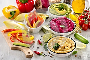Veggie hummus, different dips, vegan snack, beetroot and avocado hummus, vegetarian eating, copy space