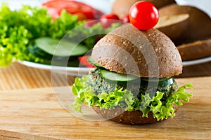 Veggie spinach burgers with rye bread, cucumber and lettuce photo