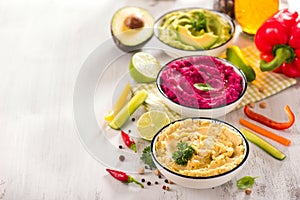 Veggies hummus, different dips, vegan snack, beetroot and avocado hummus, vegetarian eating