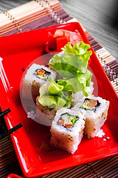 Vegitable roll on red plate