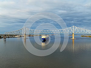A Vehicle Carrier Ship Passing under the Commodore Barry Bridge photo