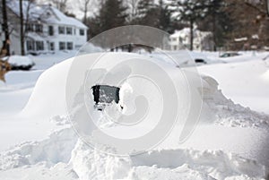 Vehicle covered with snow in winter blizzard. Cars in snowdrifts after a snowfall. After the winter storm