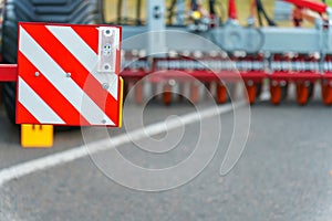 A vehicle dimensions sign is installed on the truck body. red-white striped sign