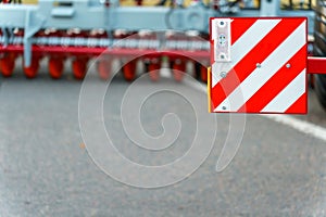 A vehicle dimensions sign is installed on the truck body. red-white striped sign