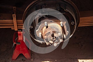 Vehicle front strut and axel in auto service mechanical workshop