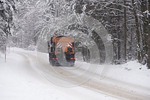 A Vehicle gritting winter road