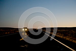 Vehicle on highway at night