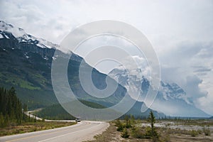 Vehicle moving on winding scenic Icefields parkway