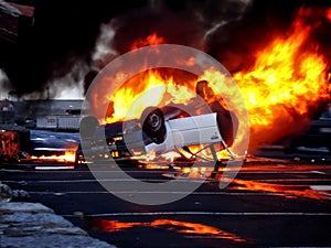 A vehicle overturned in flames