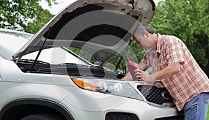 Vehicle Owner Checks Oil