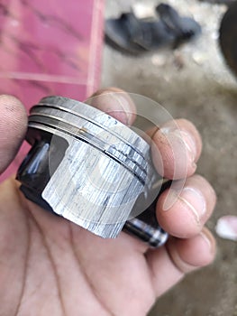 a vehicle piston that is damaged due to frequent use