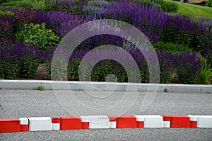 Vehicle protection entry barrier, lane-to-lane crossing road markings deceleration element in traffic red white plastic fastened a