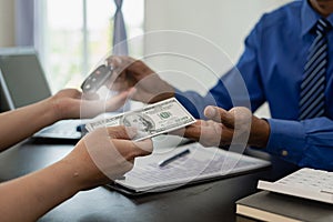 Vehicle rental business concept Close up of hands of car rental agent giving car remote key