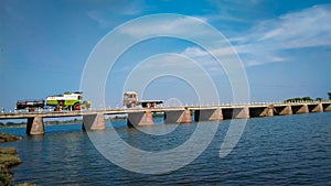 Vehicles on bridge, bridge over river, over river bridge