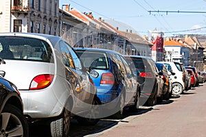 Vehicles in city downtown`s parking lot