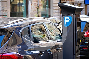 Vehicles in city downtown`s parking lot