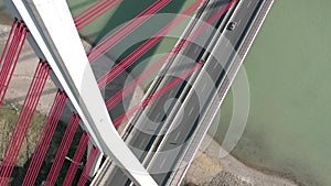 Vehicles Crossing a Cable Stayed Suspension Bridge Crossing a River