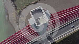 Vehicles Crossing a Cable Stayed Suspension Bridge Crossing a River