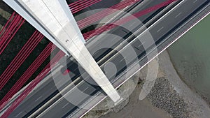 Vehicles Crossing a Cable Stayed Suspension Bridge Crossing a River