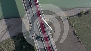 Vehicles Crossing a Cable Stayed Suspension Bridge Crossing a River