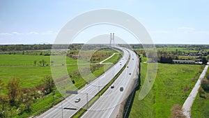 Vehicles drive on long overpass highway leading to Redzinski Bridge