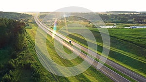 Vehicles Machines Driving Fast On High Speed Highway Against Sunset Aerial View