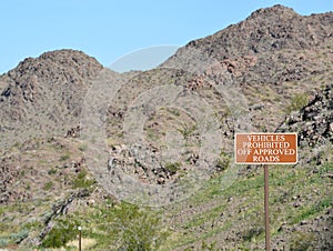Vehicles Prohibited Off Approved Roads Sign in the mountainous region of Lake Mead National Recreation Area, Mohave County, Arizon