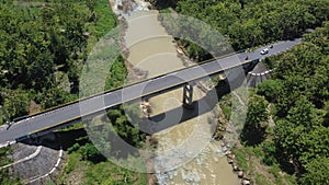 A vehicular traffic bridge over a large river in Yogyakarta, Indonesia