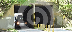 A vehicular tunnel shown with traffic photo